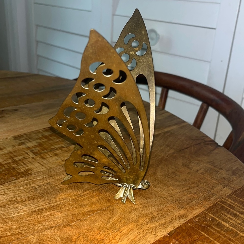 Brass butterfly sits upright on a table. Gorgeous wings and in great condition.